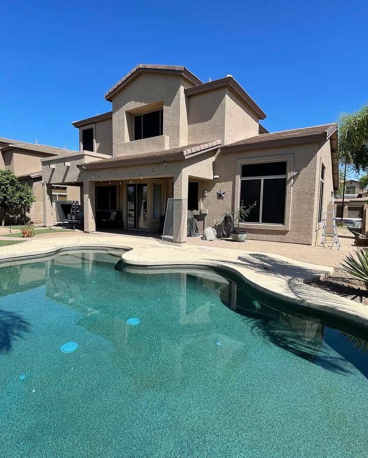 Custom solar screens on a two-story home with pool in Vail, Arizona